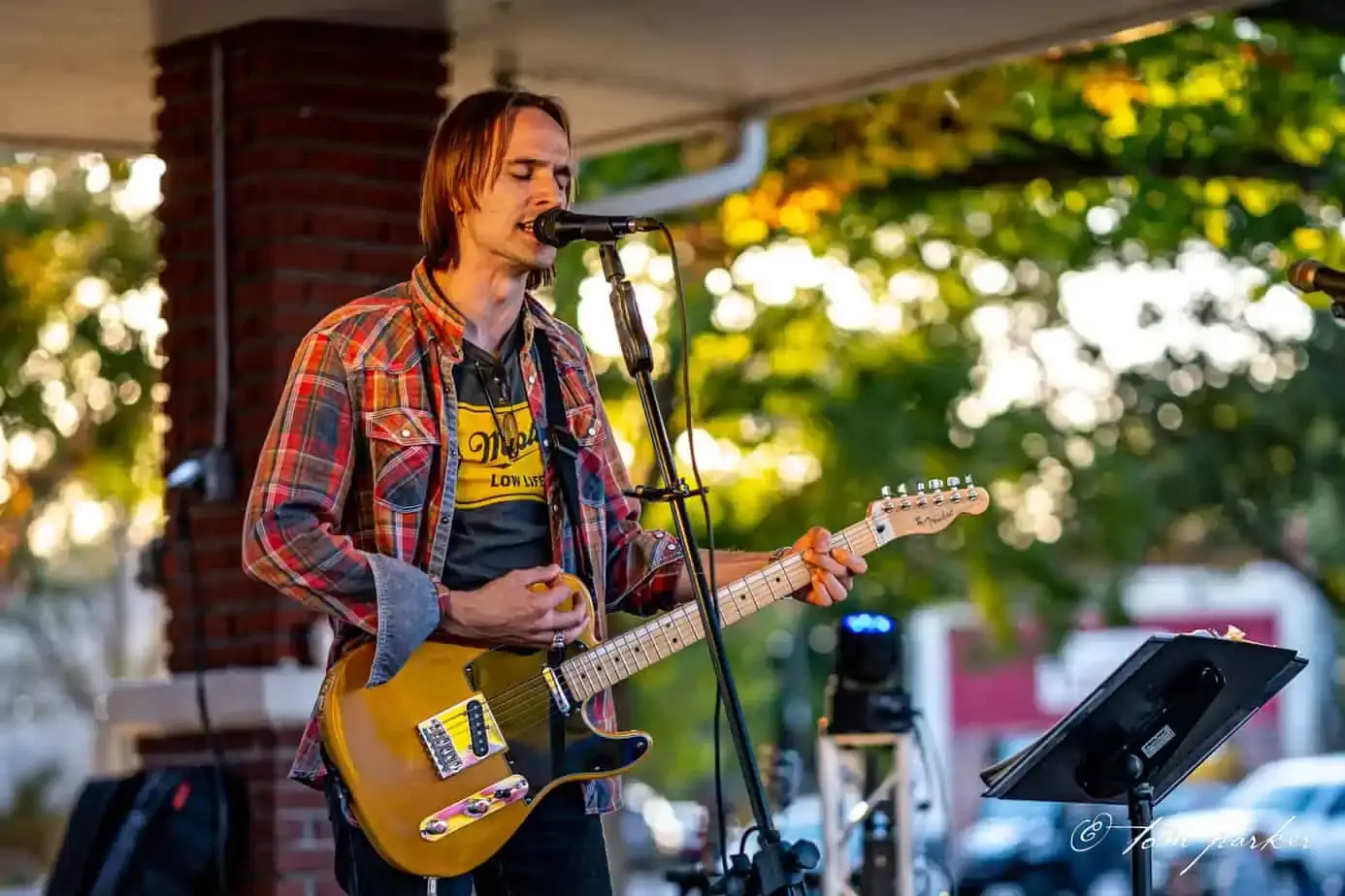 An aerial view of a country road at sunset.